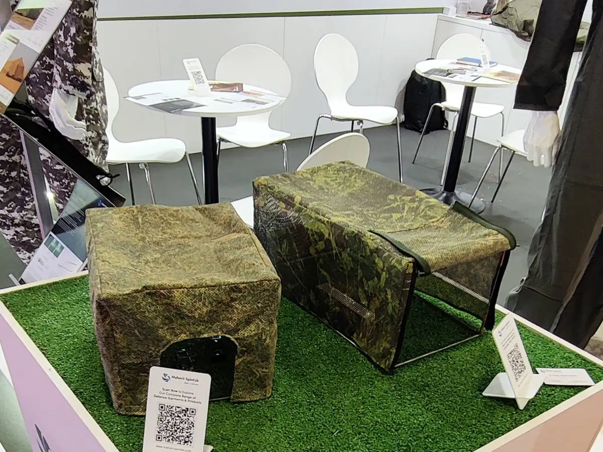 Multi-spectral camouflage nets (MSCN) and tactical gear display at Mahavir Spinfab Milipol Paris booth.